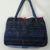 Handbag with a blue bow